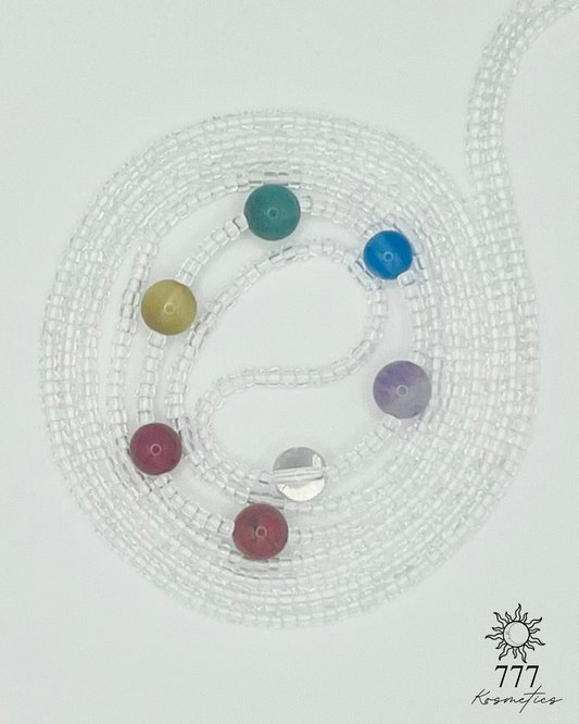 Waist beads with clear seed beads. Includes genuine red jasper, carnelian, honey tiger eye, green aventurine, blue agate, banded amethyst, and clear quartz gemstones. 
