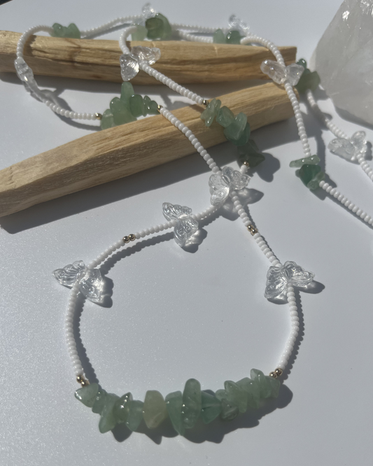 "Lucky Meadow" tie on waist beads made with genuine green aventurine crystal chips, glass butterflies, 14k gold filled beads, and white beads. Made with high quality, mildew resistant string. 