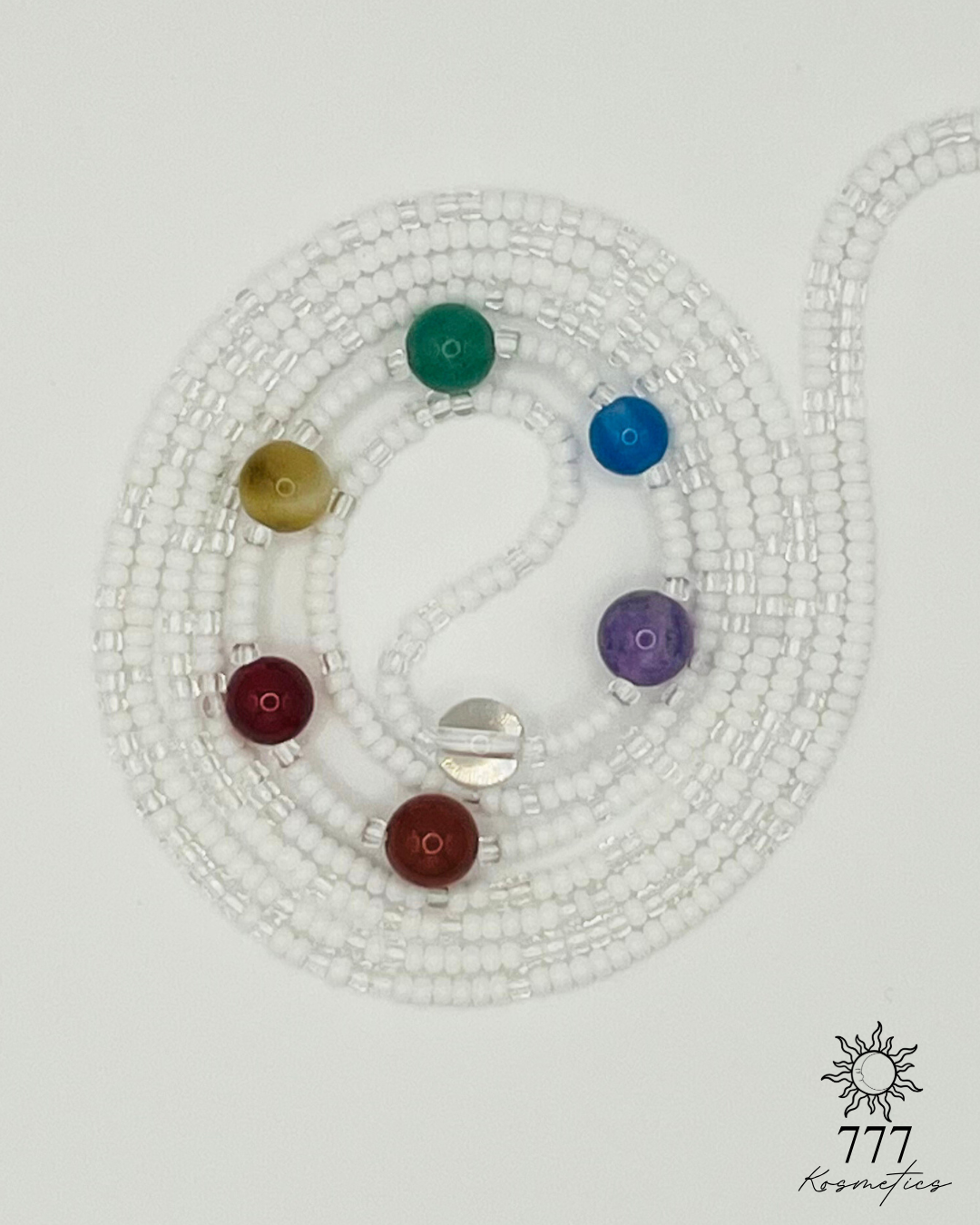 Waist beads with clear and white seed beads. Includes genuine red jasper, carnelian, honey tiger eye, green aventurine, blue agate, banded amethyst, and clear quartz gemstones. 