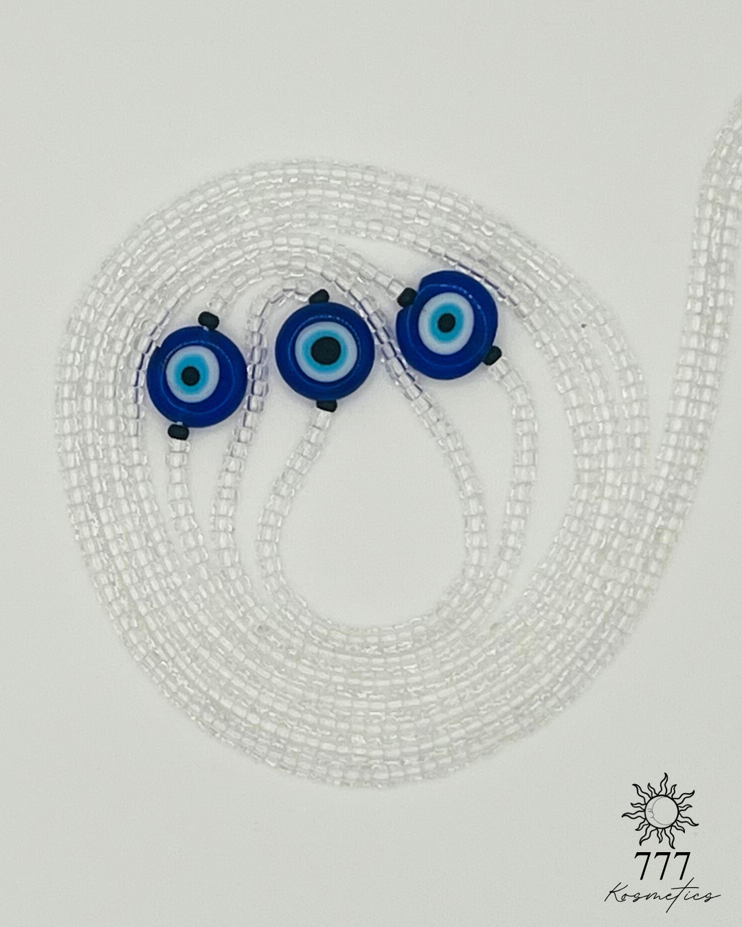 Waist Beads composed of clear seed beads, accented with matte black beads and three blue Nazar (Evil eye)