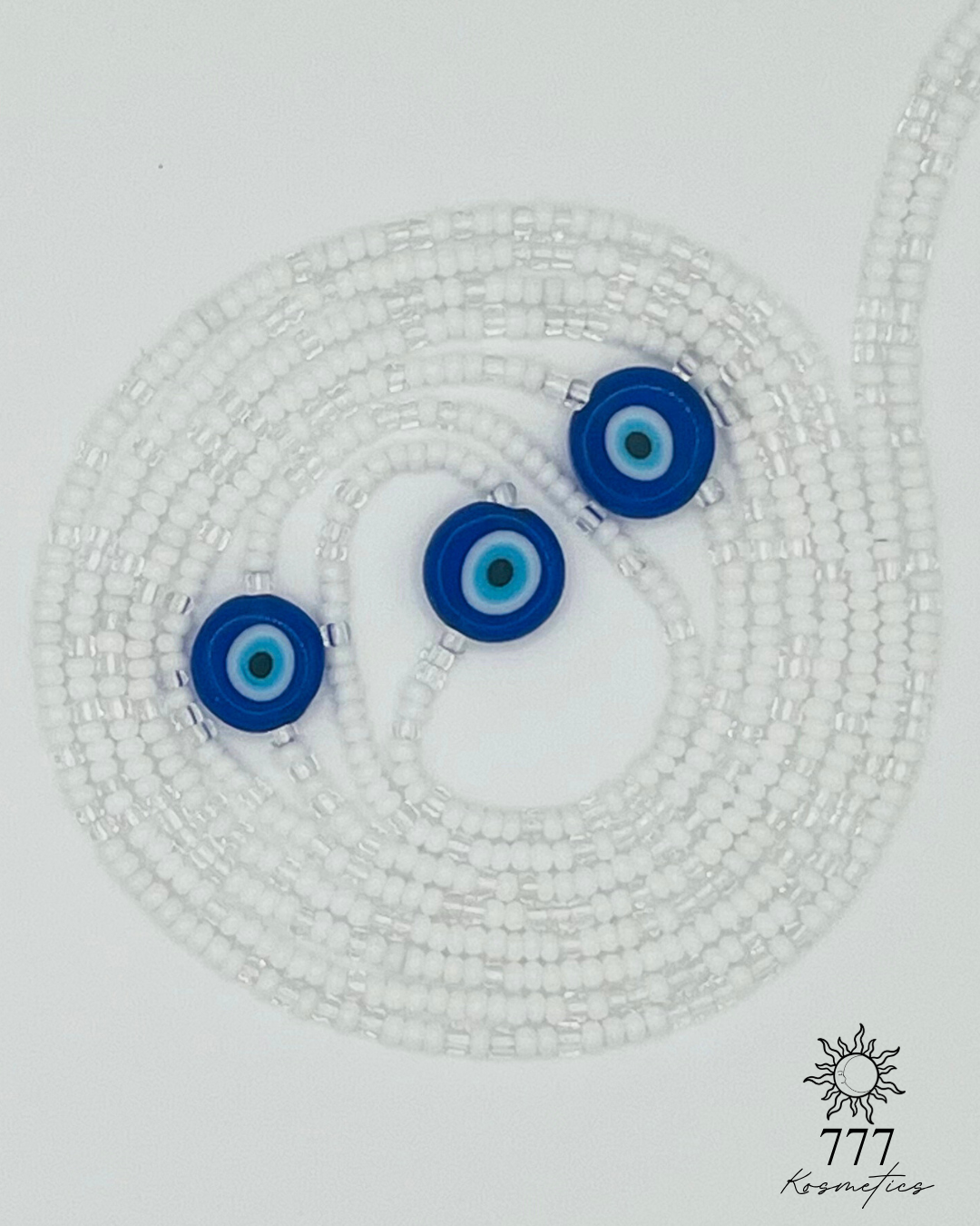Waist Beads composed of clear and white seed beads, accented with three blue Nazar (Evil eye)